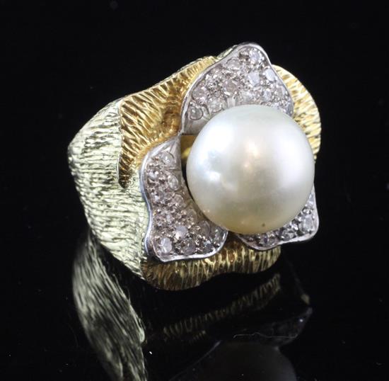 A large textured gold, baroque pearl and diamond set dress ring, size N.